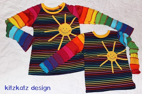 Zwei Regenbogen-Sonnen-Shirts