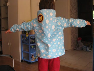 COSMA als Regenjacke - hinten