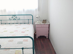 quilt. on a green bed.